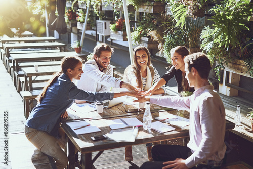 Huddle, collaboration and business people in coffee shop with agreement or celebration for success. Together, trust and team building with solidarity for partnership or startup deal outdoor at cafe photo