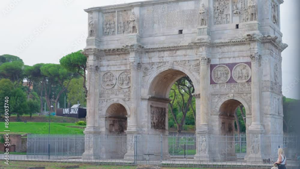 Arch of Constantine on background of blue sky on sunny day, located between coliseum and Arch of Titus on Roman road, built to celebrate triumph of
Arch of Constantine on background of blue sky on sunny day, located between coliseum and Arch of Titus on Roman road, built to celebrate triumph of