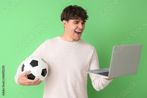Happy young man with soccer...