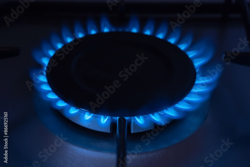 Gas burner with burning fire, close up. Flames on kitchen gas stove.