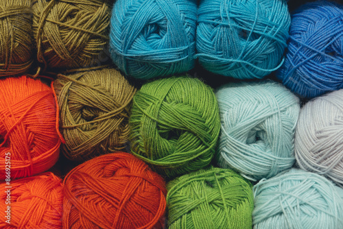 Colorful yarn balls for knitting textured background.