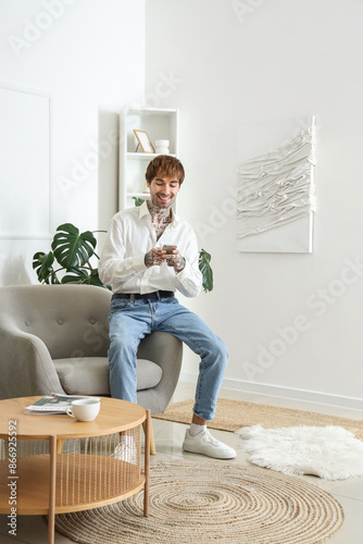 Handsome man using mobile p...