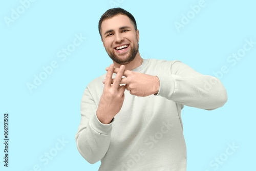Handsome young man making h...