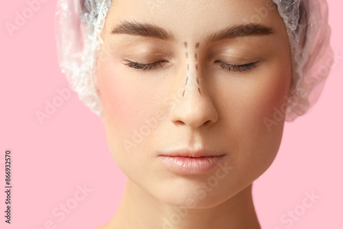Young woman in medical hat ...
