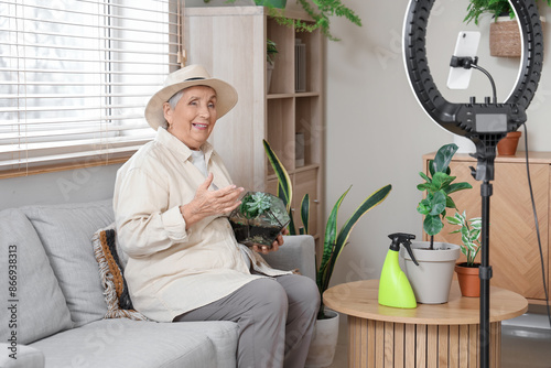 Senior gardener with florar...