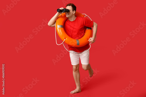 Male lifeguard with ring bu...