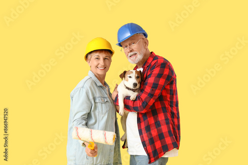 Mature couple in hardhats w...