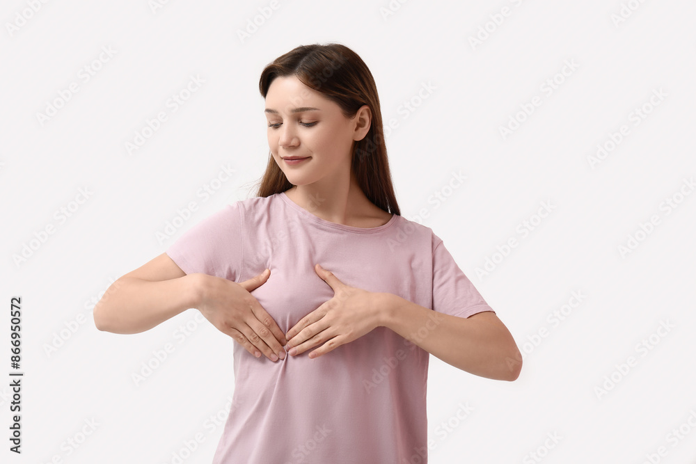 Young woman checking her breast on white background Young woman checking her breast on white background