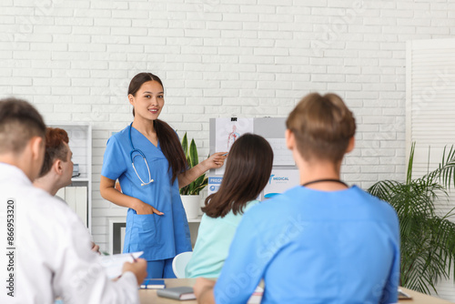 Female Asian doctor working...