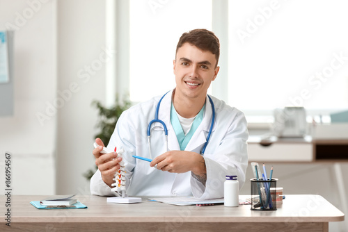 Young male doctor with spin...