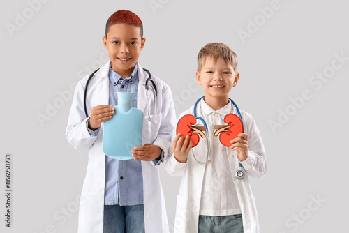 Little doctors with paper k...