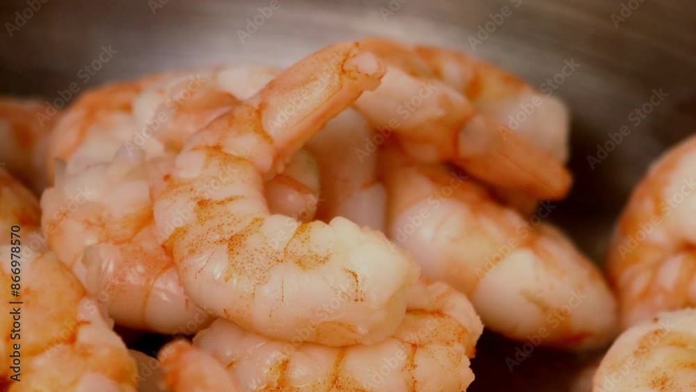 shrimps are fried in oil in a frying pan shrimps are fried in oil in a frying pan