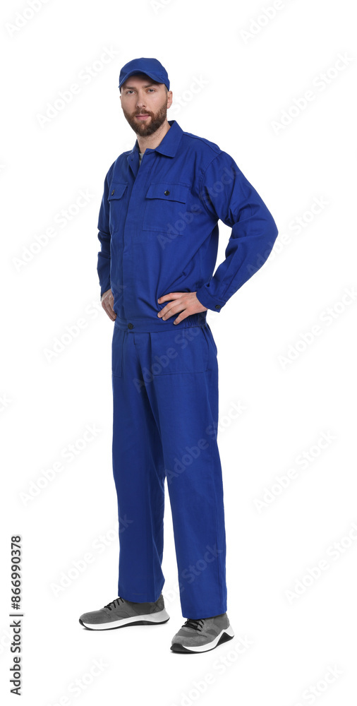Fototapeta premium Professional auto mechanic in blue uniform on white background