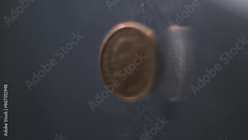 One Penny coin rotating slow motion, 0,01 £, vertical view