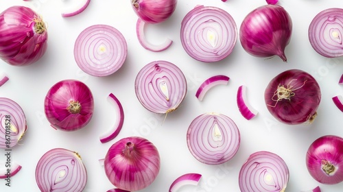 Red onions sliced and whole arranged on white background, flat lay. Fresh vegetable and culinary concept