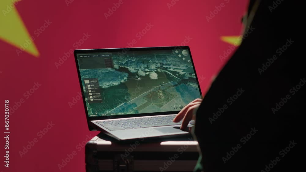 Chinese soldier in command control room using military tech to identify threats from enemies. Army personnel using software on laptop to communicate information to generals on war front line, camera A Chinese soldier in command control room using military tech to identify threats from enemies. Army personnel using software on laptop to communicate information to generals on war front line, camera A