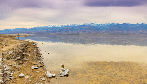 Female Hiker on The Shore of Manly Lake That Has Flooded Bad Water Basin, Death Valley National Park, California, USA