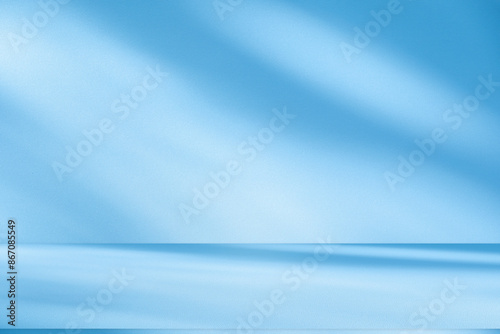 Wall interior background  studio and backdrops show products.with shadow from window color white and blue. background for text insertion and presentation product 