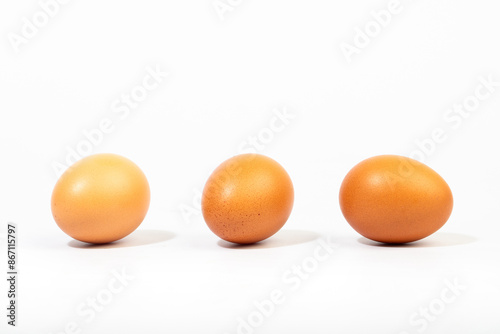 Brown eggs on a white background