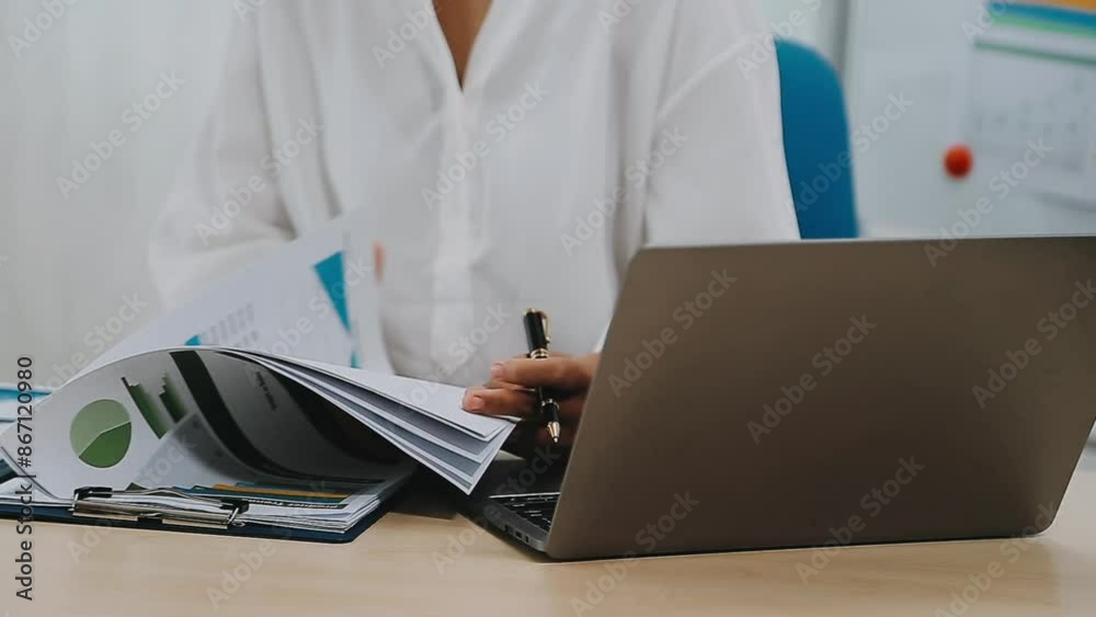 Young Business Asian woman using the tablet for doing math finance on wooden desk in office, analysis, seo, data, analyst, asian, financial, tax, accounting, Report financial document concept