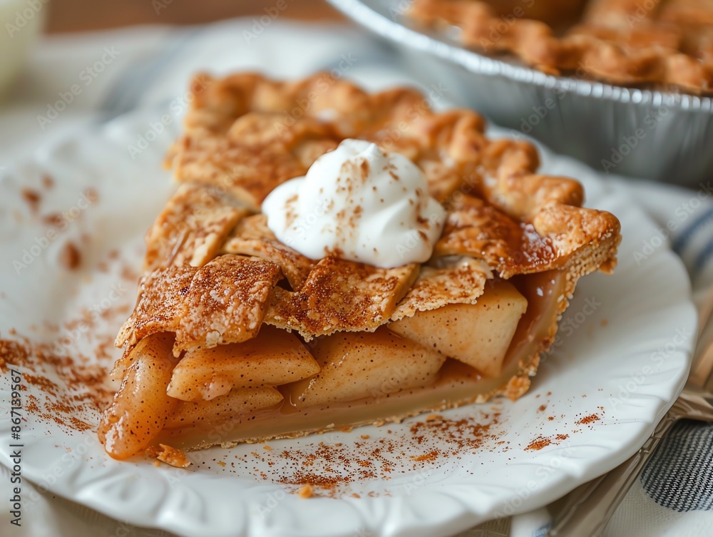 Gluten-free apple pie with an almond flour crust, served with a dollop of Greek yogurt on a white plate Gluten-free apple pie with an almond flour crust, served with a dollop of Greek yogurt on a white plate