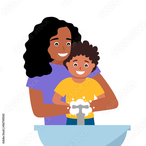 Caring mother and little son washing hands together in bathroom sink. Smiling mom help small child clean hands in bath.