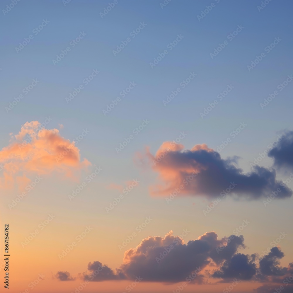 Fototapeta premium Vibrant sunset sky with fluffy clouds, capturing the transition from day to night.