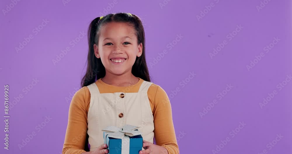 Happy girl, box and wow with surprise for gift, birthday or secret parcel in studio on a purple background. Portrait of female person, child or kid with smile for present, ribbon or cool package Happy girl, box and wow with surprise for gift, birthday or secret parcel in studio on a purple background. Portrait of female person, child or kid with smile for present, ribbon or cool package