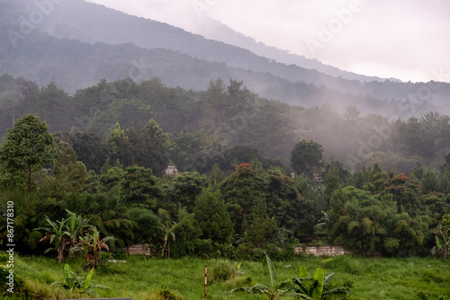 Beautiful view of the hills of Mount Salak when covered in white clouds.
