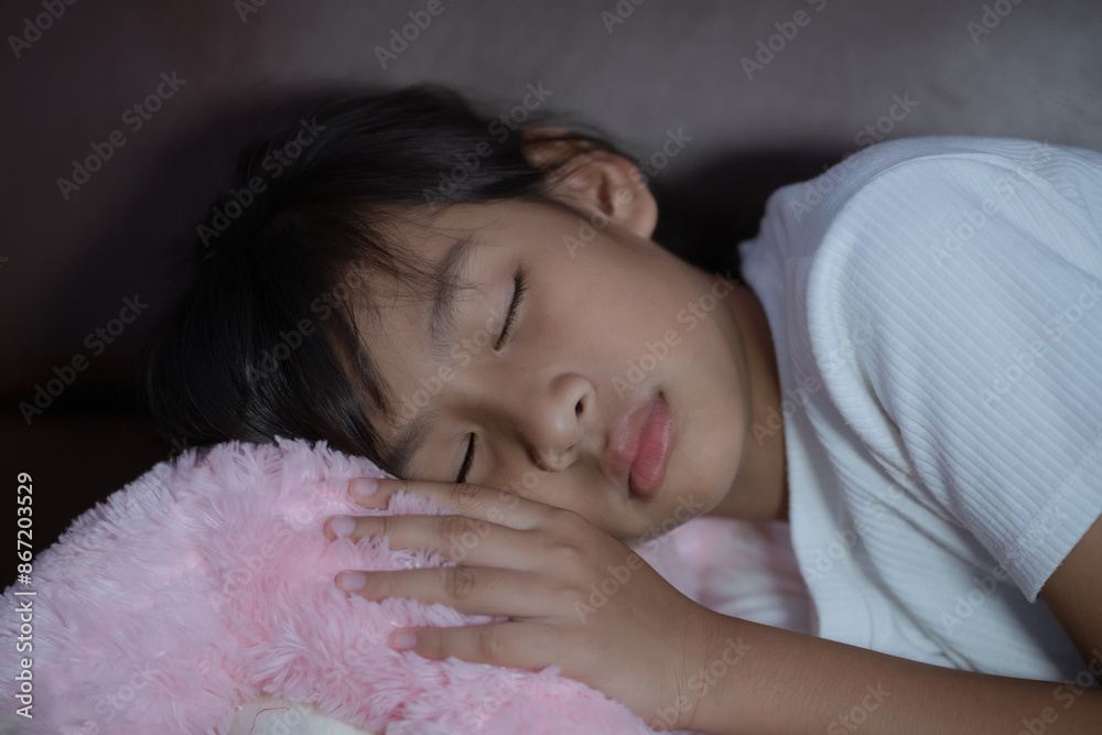 Little girl Asian kid sleeping on cozy sofa at home. Little girl Asian kid sleeping on cozy sofa at home.