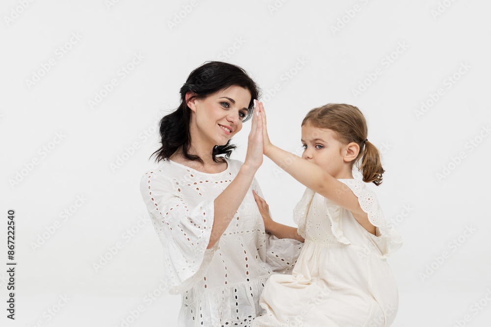 Close-up of tender touches and sensitive moment between mother and daughter. Happy motherhood, understanding and harmonious relationship between child and mother. Close-up of tender touches and sensitive moment between mother and daughter. Happy motherhood, understanding and harmonious relationship between child and mother.