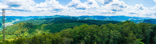 Obraz na płótnie Germany, XXL aerial panorama nature landscape view above schwarzwald tree tops, mountains, valleys and wind turbines on sunny day near haslach im kinzigtal w salonie