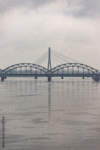 cloudy city with brigde over the river daugava