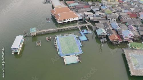 Aerial view of Koh Panyee, The Floating village urban city town houses, lake sea or river. Nature landscape fisheries and fishing tools at Pak Pha, Phang Nga, Thailand. Aquaculture farming
