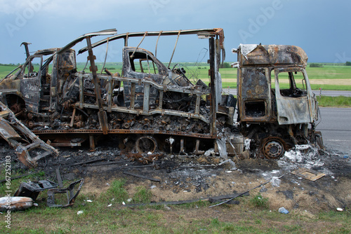 Tablou pe pânză Burnt truck with a burnt-out driver's cab, accident.