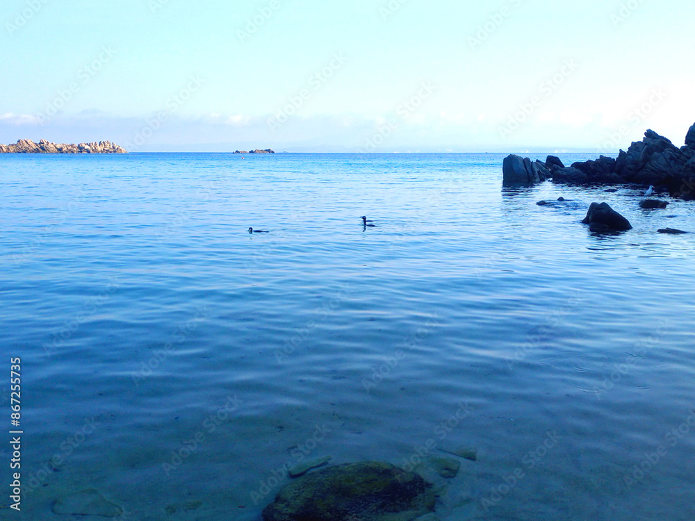 Obraz premium Beautiful sea view of the beach in Sardinia. Blue Mediterranean sea. Sea in the Morning. Island Sardinia in Italy.