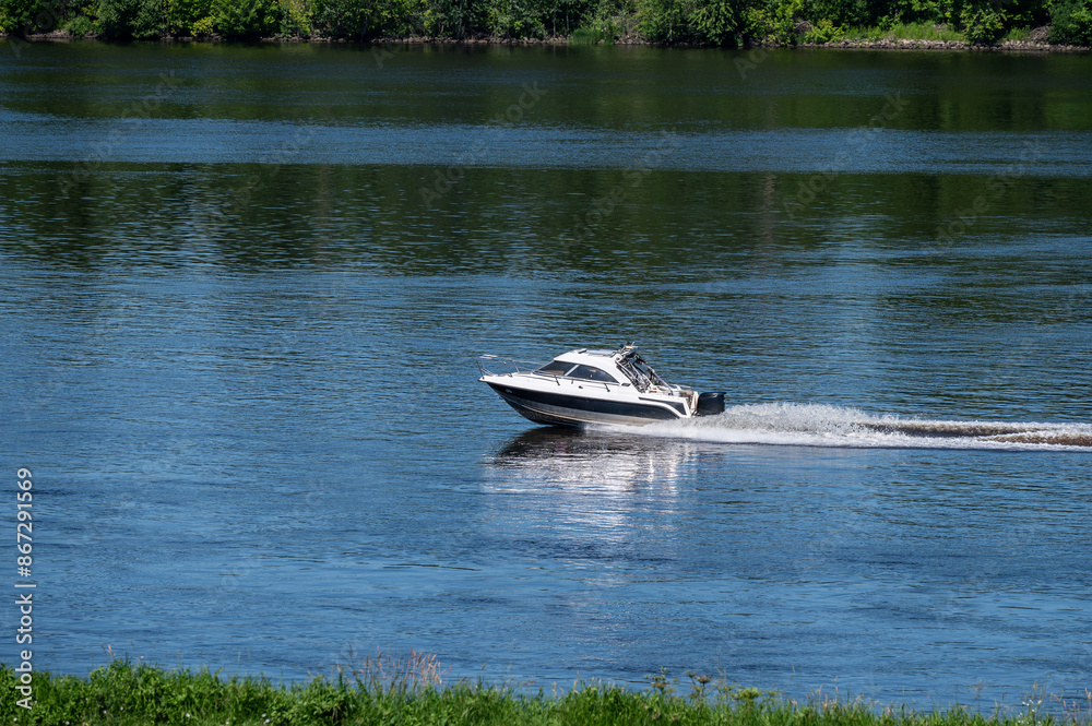 Fototapeta premium Motor boat goes fast on water.