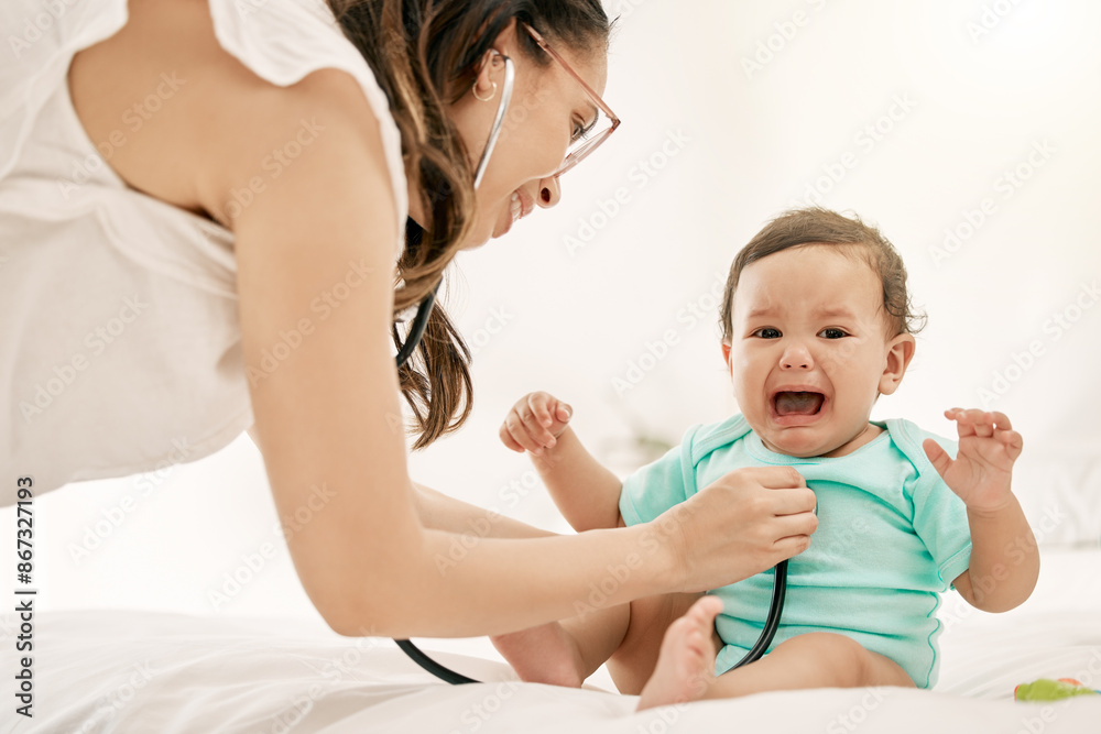 Doctor, baby and woman with stethoscope on bed for consultation, paediatrics or chest checkup with home visit. Healthcare, female physician and crying child for discomfort, diagnosis or wellness Doctor, baby and woman with stethoscope on bed for consultation, paediatrics or chest checkup with home visit. Healthcare, female physician and crying child for discomfort, diagnosis or wellness