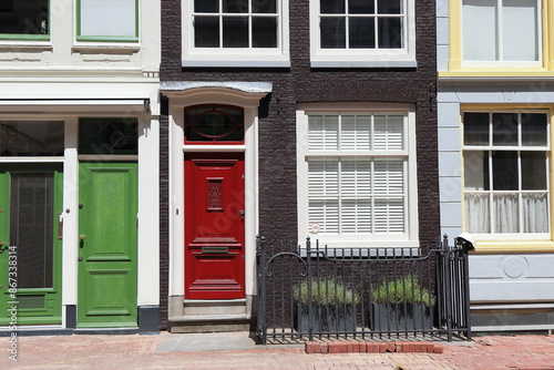 Canvas Print Amsterdam Kerkstraat Street View with Green and Red Doors, Netherlands