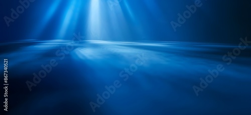A beautiful blue background with smooth light beams.

