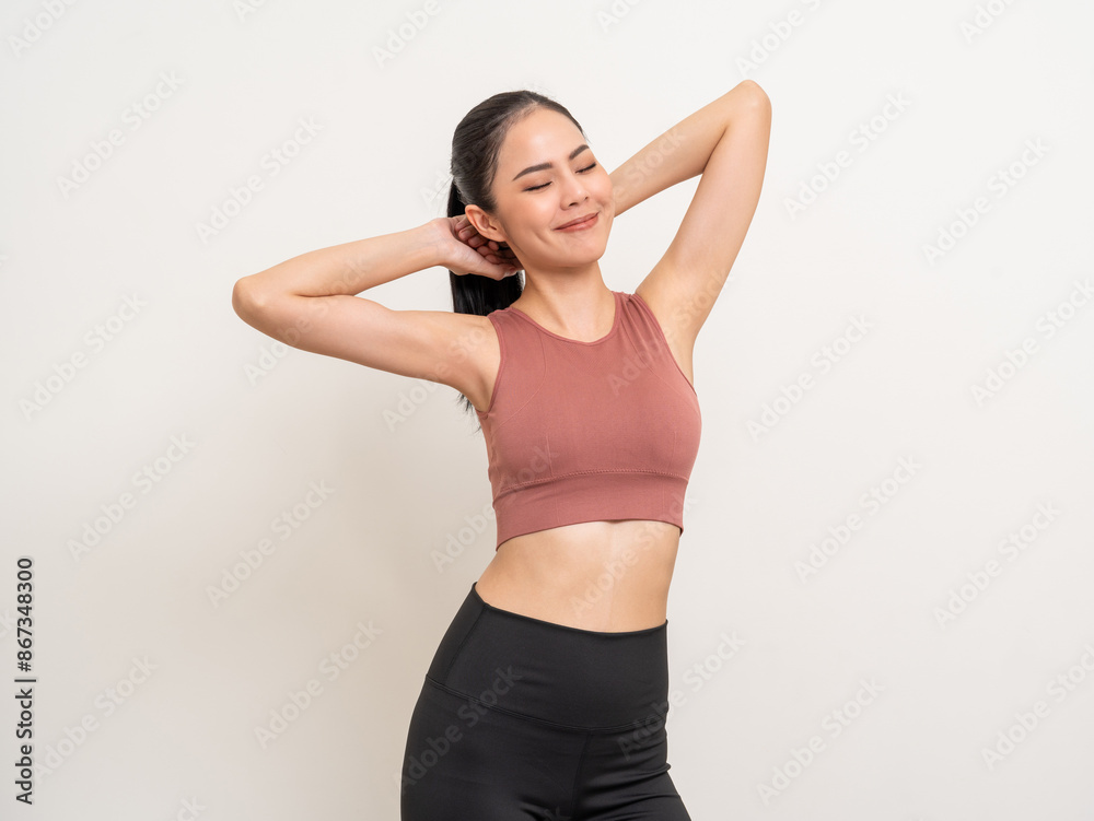Young beautiful smiling asian woman with sportswear on isolated white background. Portrait happy healthy slim fit and firm latin attractive sporty woman standing pose exercise workout in studio. Young beautiful smiling asian woman with sportswear on isolated white background. Portrait happy healthy slim fit and firm latin attractive sporty woman standing pose exercise workout in studio.