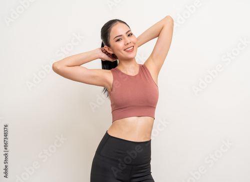 Young beautiful smiling asian woman with sportswear on isolated white background. Portrait happy healthy slim fit and firm latin attractive sporty woman standing pose exercise workout in studio.