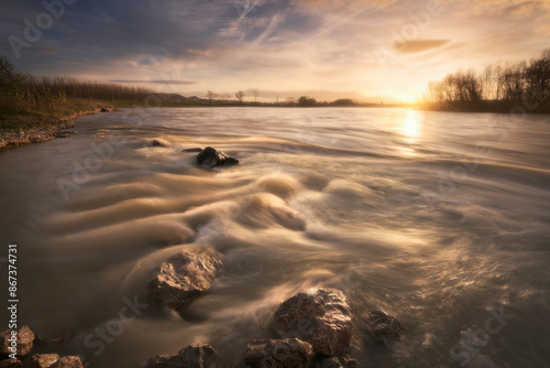 Schilderij op canvas sunset on the Ebro river as it passes through Alfaro, La Rioja, with the water r