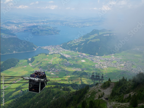 Obraz na płótnie CabriO cable car to Stanserhorn with Lake Luzern in background w salonie
