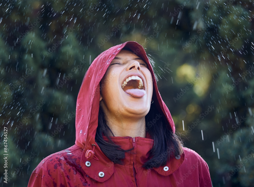 Φωτογραφία Drinking, water and woman in rain, outdoor and carefree in winter, holiday and raincoat for weather