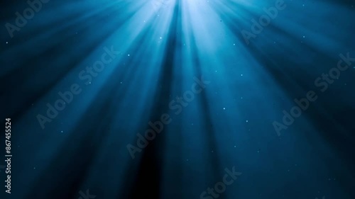 Light rays from top with floating flying glitter particles in air mist or steam, overlay special vfx ambient effect animation for atmospheric videos or underwater scenes. Stage spot light effect. 