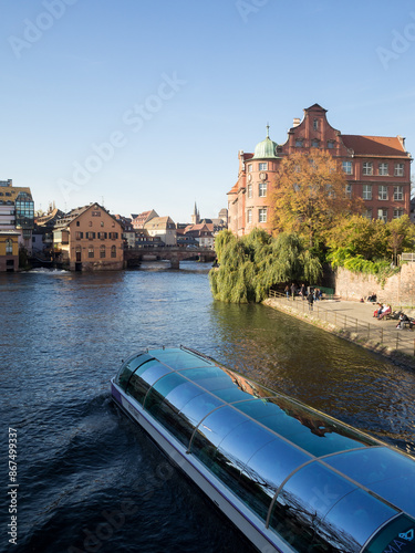 Tourist boat travelling Ill River in Strasbourg