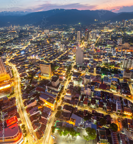 Golden hour view of George Town and city lights from the top of Komtar Tower,Penang Island,Malaysia.