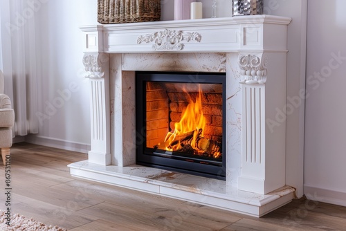 White Fireplace with Burning Logs and Marble Surround