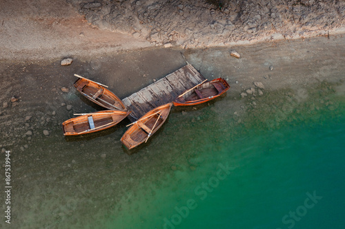 View of the Black Lake or Crno jezero , northern Montenegro. Tourist boats near wooden pier on Black lake in Durmitor national park near Zabljak, Europe photo